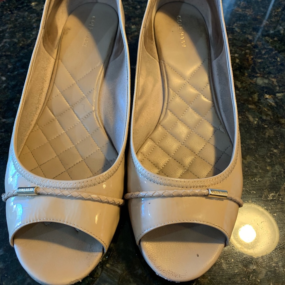 Flesh tone peep toe small wedge shoe.